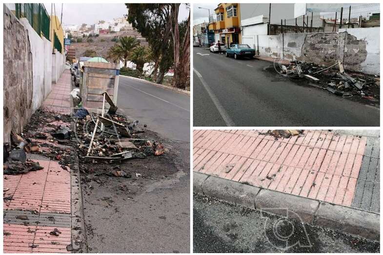 Restos de los dos contenedores quemados en el casco antiguo de Jinámar, a la altura del número 71 (Foto TA)